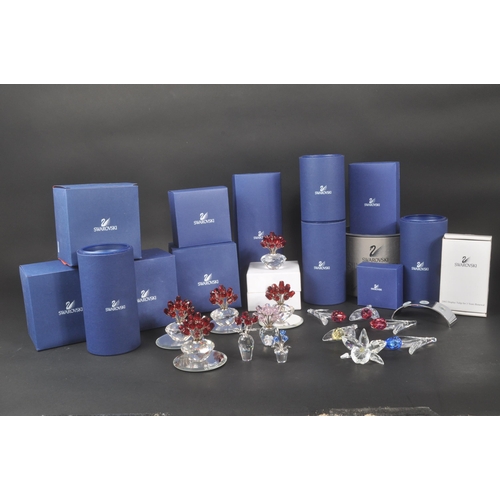 89 - Swarovski - A collection of Swarovski crystal decorative floral figures / ornaments. The collection ... 