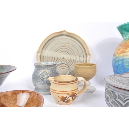 90 - A large collection of 20th century studio pottery pieces. The collection featuring a variety of vase... 