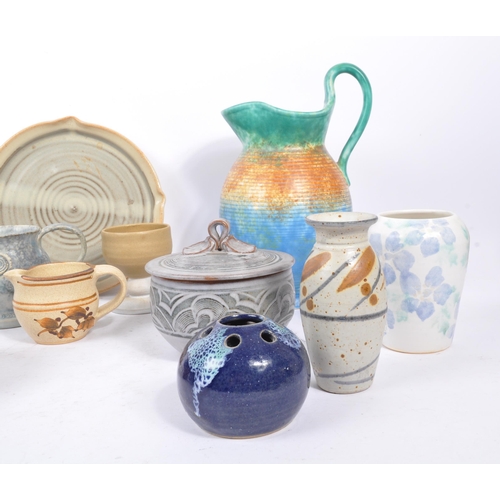 90 - A large collection of 20th century studio pottery pieces. The collection featuring a variety of vase... 