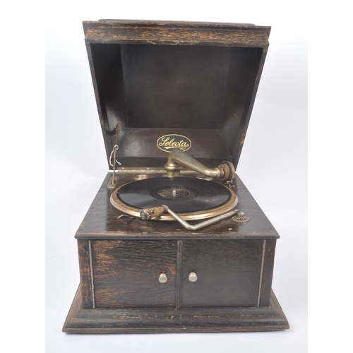 413 - Selecta - An early 20th century Art Deco oak gramophone / record player. Having an oak case with hin... 