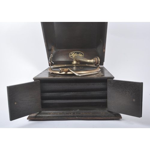 413 - Selecta - An early 20th century Art Deco oak gramophone / record player. Having an oak case with hin... 