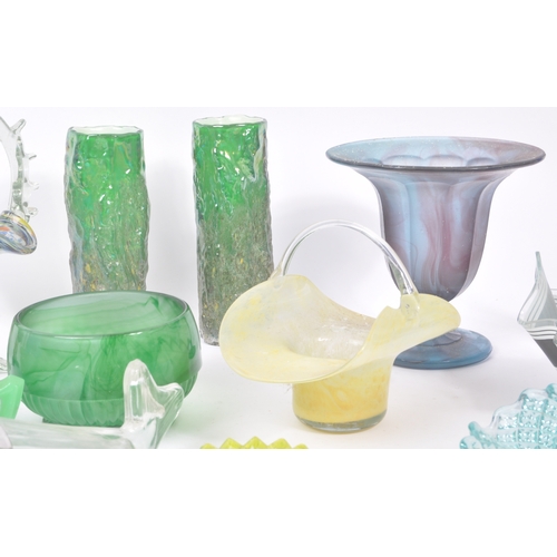 144 - A collection of mid 20th Century glass to include bowls, vases, glass baskets and a clown figure. So... 