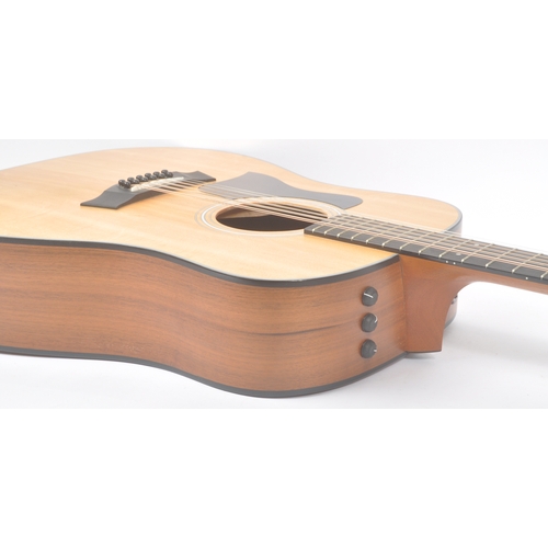 422 - Taylor - A contemporary electro acoustic left handed twelve stringed guitar. Model number 150e, seri... 