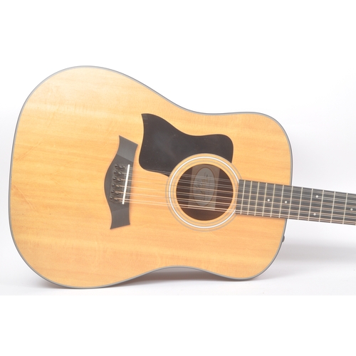 422 - Taylor - A contemporary electro acoustic left handed twelve stringed guitar. Model number 150e, seri... 