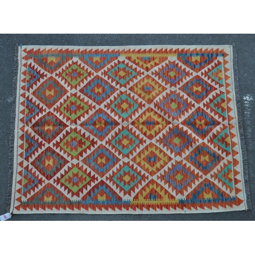 1068 - A vintage 20th century Anatolian Turkish kilim carpet floor rug. With repeating diamond pattern with... 