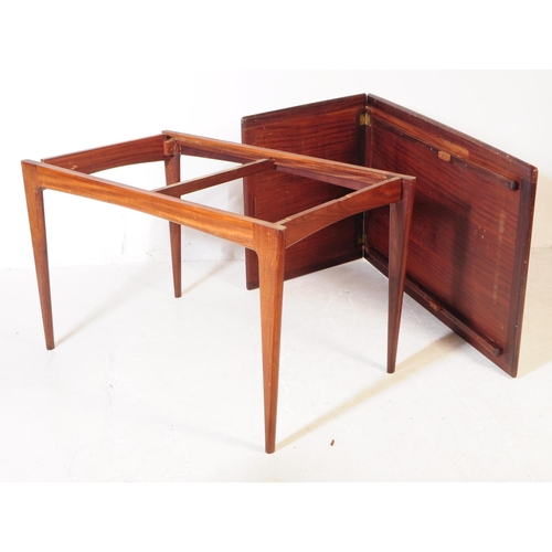 550 - A retro 20th century Danish influenced teak extending dining table. The table having a round rectang... 