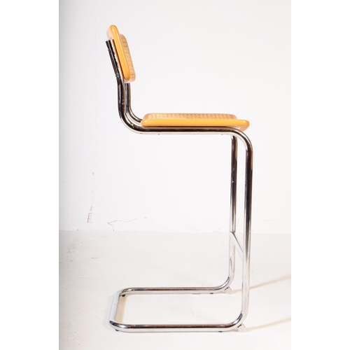 576 - Manner of Habitat - A pair of 20th century chrome and rattan weave cantilever bar stools in the mann... 