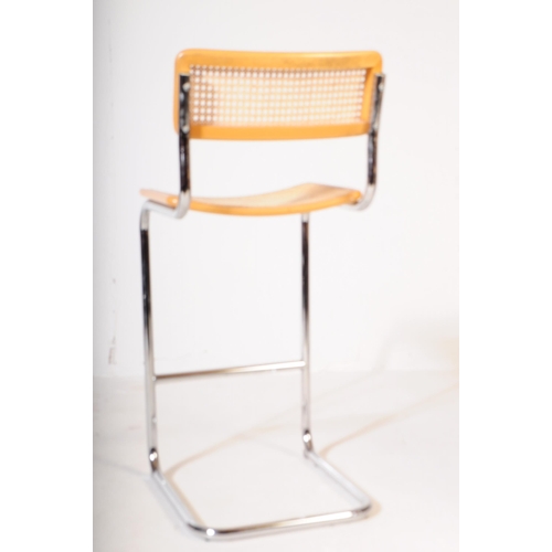 576 - Manner of Habitat - A pair of 20th century chrome and rattan weave cantilever bar stools in the mann... 