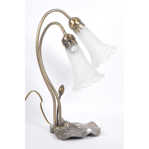 594 - A later 20th century Art Nouveau style design table lamp. Modelled lily leaf base with two frosted g... 