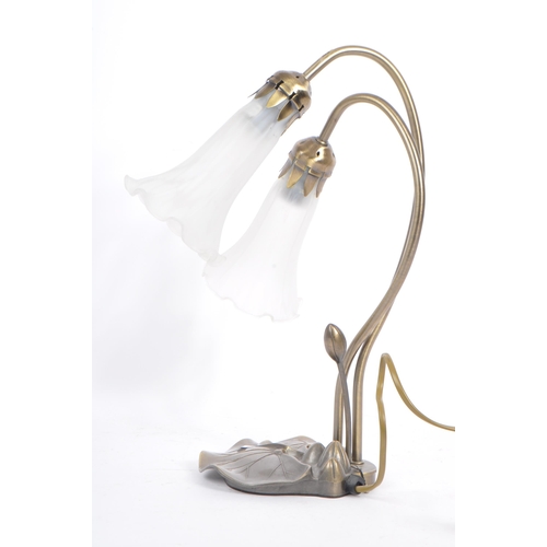 594 - A later 20th century Art Nouveau style design table lamp. Modelled lily leaf base with two frosted g... 