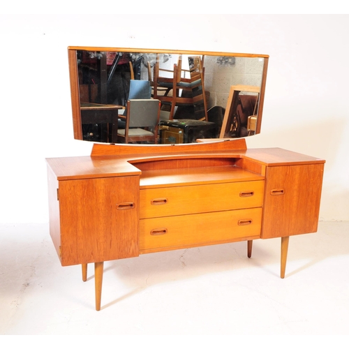 611 - Lebus - A mid 20th century Lebus teak wood dressing table. The dresser of inverse breakfront form, w... 