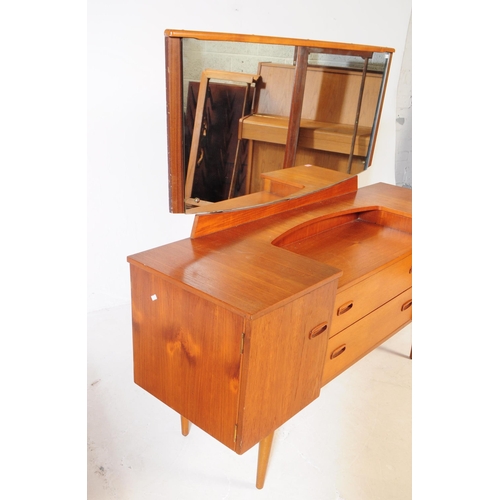 611 - Lebus - A mid 20th century Lebus teak wood dressing table. The dresser of inverse breakfront form, w... 