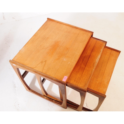 615 - G-Plan - A mid 20th century G Plan teak wood quadrille nest of tables. The nest consisting of a set ... 