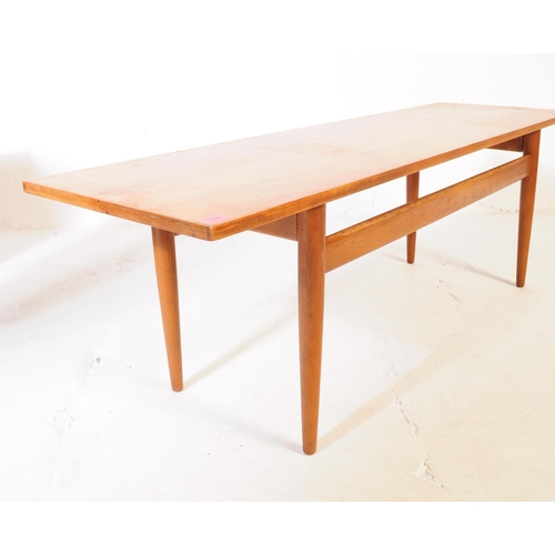 616 - Scandart Furniture - A mid 20th century Scandart teak long john coffee table. The table of rectangul... 