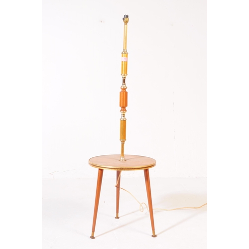 653 - Mid-century standard lamp in teak with terraced table centre and shade above. Measures approx. 120x2... 