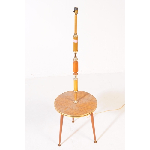 653 - Mid-century standard lamp in teak with terraced table centre and shade above. Measures approx. 120x2... 