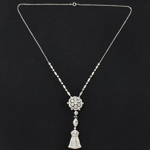 1 - A cased Edwardian platinum and diamond pendant necklace. The necklace strung with an articulating ta... 