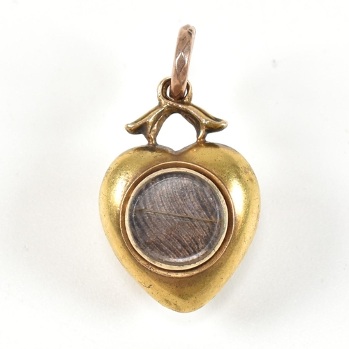 10 - A 19th century 15ct gold and turquoise heart locket pendant. The Georgian pendant set with turquoise... 