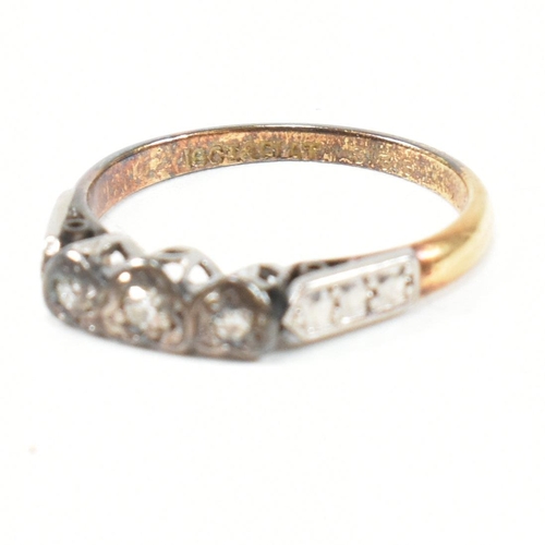 102 - An 18ct gold and platinum diamond ring. The ring having three graduating round cut diamonds set in a... 