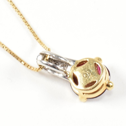 106 - An Italian 18ct gold, ruby and diamond target pendant necklace. The 18ct yellow gold box chain neckl... 