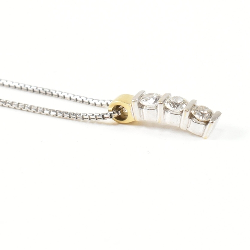 11 - An 18ct white gold and diamond pendant necklace. The 18ct white gold box chain necklace strung with ... 