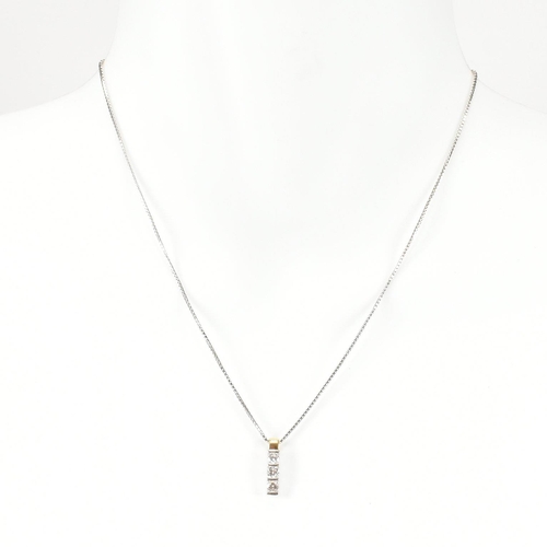 11 - An 18ct white gold and diamond pendant necklace. The 18ct white gold box chain necklace strung with ... 