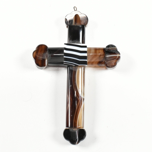 110 - A French carved banded agate cross pendant. The cross having a fluted body, to carved finials, with ... 