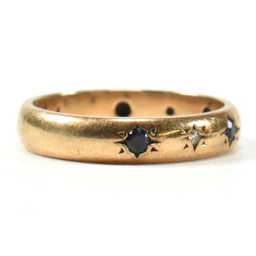 115 - A hallmarked 9ct gold, sapphire and diamond band ring. The gold band ring set with four star set rou... 