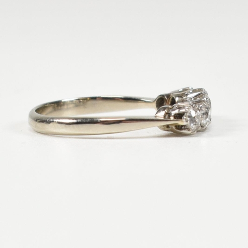 116 - An 18ct white gold and platinum diamond five stone ring. The ring set with five old cut diamonds to ... 