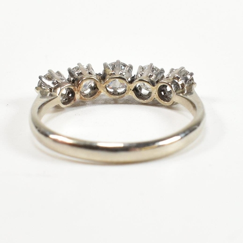 116 - An 18ct white gold and platinum diamond five stone ring. The ring set with five old cut diamonds to ... 