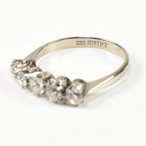 116 - An 18ct white gold and platinum diamond five stone ring. The ring set with five old cut diamonds to ... 