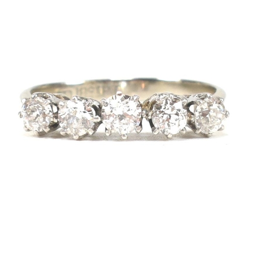 116 - An 18ct white gold and platinum diamond five stone ring. The ring set with five old cut diamonds to ... 