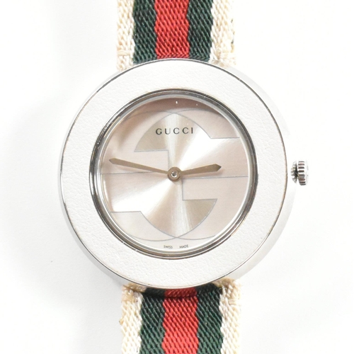 117 - Gucci U-Play wrist watch. The wrist watch having silver face with interchangeable straps and dust po... 