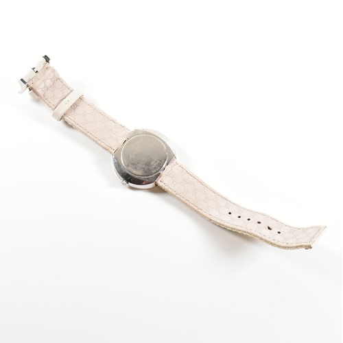 117 - Gucci U-Play wrist watch. The wrist watch having silver face with interchangeable straps and dust po... 