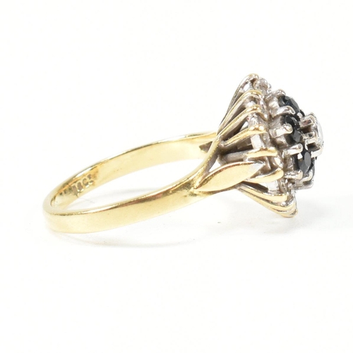 118 - An 18ct gold, sapphire and diamond cluster ring. Marked 18ct. Size J.5. Weight 4.7g. All weights, me... 