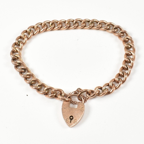 121 - A 9ct rose gold heart padlock and curb link chain bracelet. The hallmarked 9ct gold curb link bracel... 