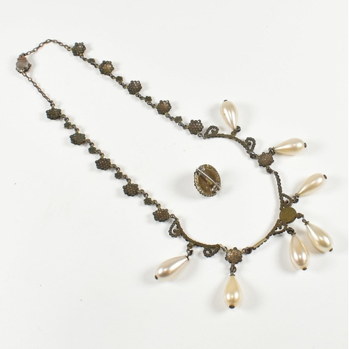 125 - A cased 19th century Victorian cut steel and simulated pearl festoon necklace and brooch parure . Th... 