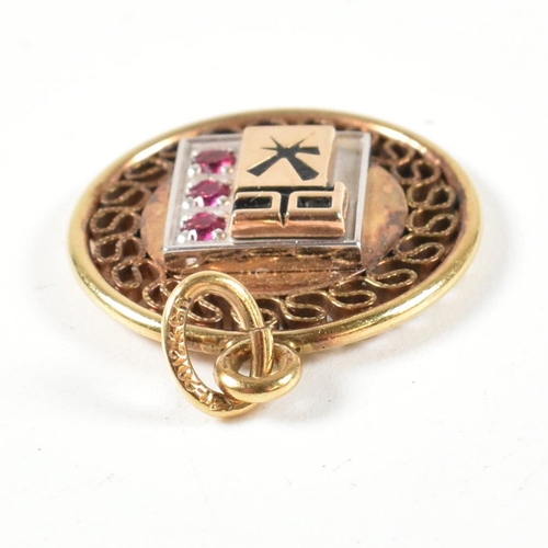 127 - A 9ct and pearl stick pin together with two 12ct Gold filled service medals set with synthetic ruby ... 