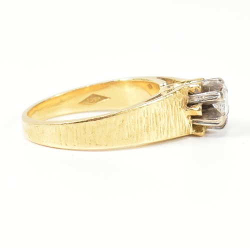 136 - A hallmarked 18ct gold and diamond solitaire ring. The ring having a single six claw set round brill... 