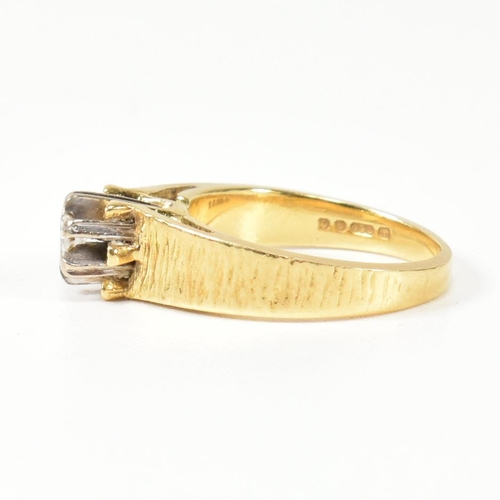 136 - A hallmarked 18ct gold and diamond solitaire ring. The ring having a single six claw set round brill... 