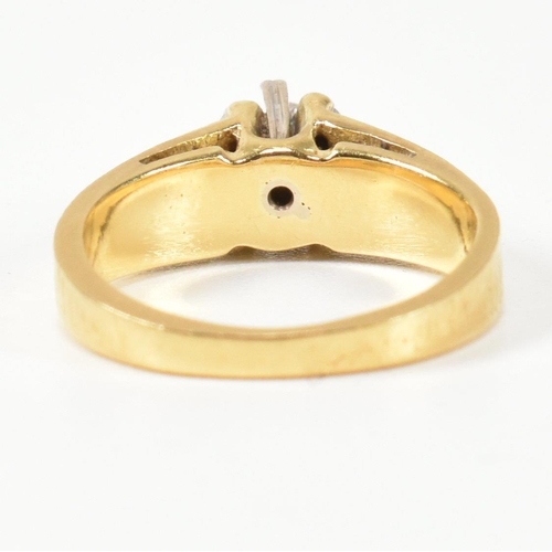 136 - A hallmarked 18ct gold and diamond solitaire ring. The ring having a single six claw set round brill... 