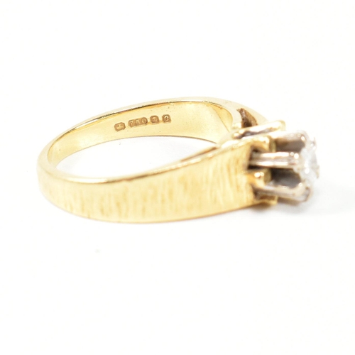 136 - A hallmarked 18ct gold and diamond solitaire ring. The ring having a single six claw set round brill... 