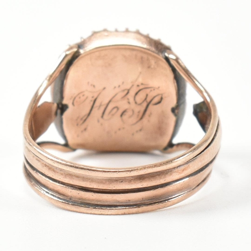 138 - A Georgian gold and paste hair locket ring. The Georgian gold ring having a bezel set cased locket o... 