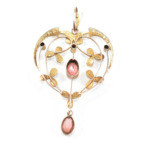 139 - An Edwardian 9ct gold, tourmaline and seed pearl necklace pendant. The art nouveau necklace pendant ... 