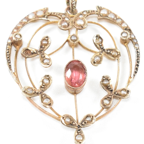 139 - An Edwardian 9ct gold, tourmaline and seed pearl necklace pendant. The art nouveau necklace pendant ... 