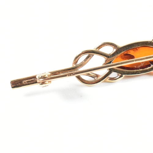 147 - A hallmarked 9ct gold and amber jewellery suite. The jewellery to include a hallmarked 9ct gold and ... 