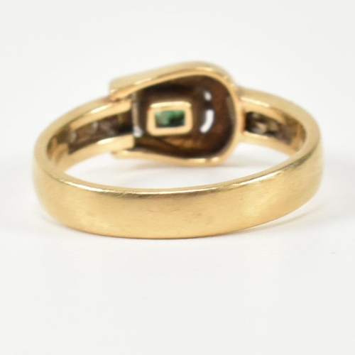 148 - An 18ct gold, diamond and emerald buckle ring. The gold buckle ring having a bezel set east-west eme... 