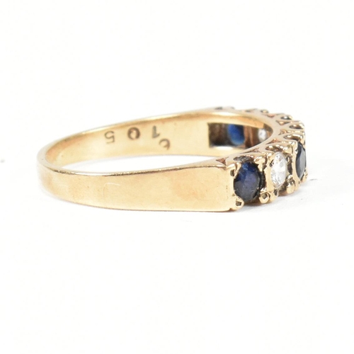 151 - A hallmarked 9ct gold, sapphire and CZ half hoop ring. The ring set with four round cut sapphires in... 