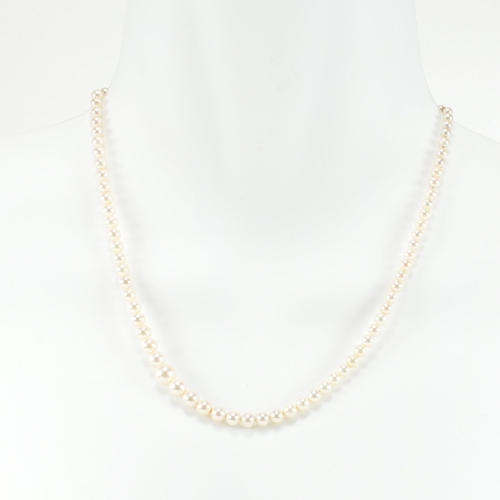 153 - A 9ct white gold and cultured pearl necklace. The single strand necklace strung with ninety five gra... 