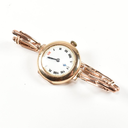 154 - A hallmarked 9ct gold watch with expanding bracelet strap. The gold watch having an enamel dial with... 